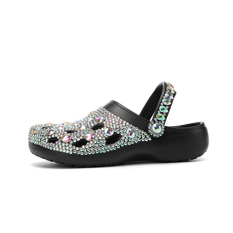 Black women's platform sandals with rhinestone details and a perforated upper on an EVA sole.