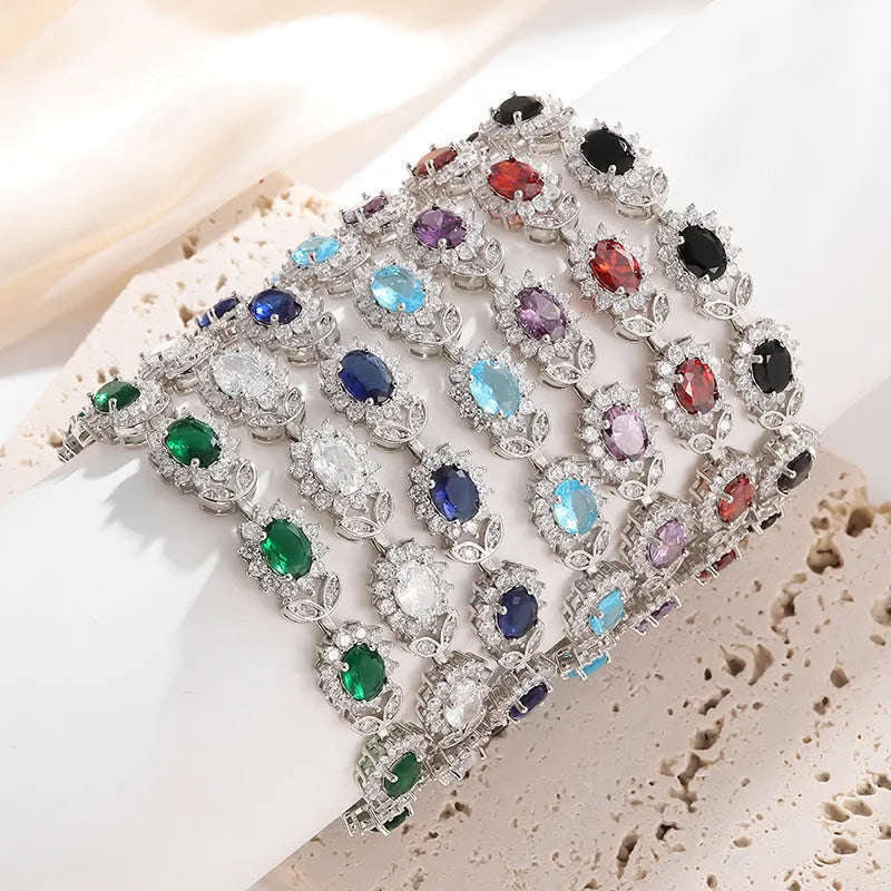 Simple women's bracelet with inlaid zircon stone on an adjustable electroplated alloy band.