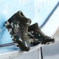 Green women's canvas sneakers with camouflage pattern and rubber soles