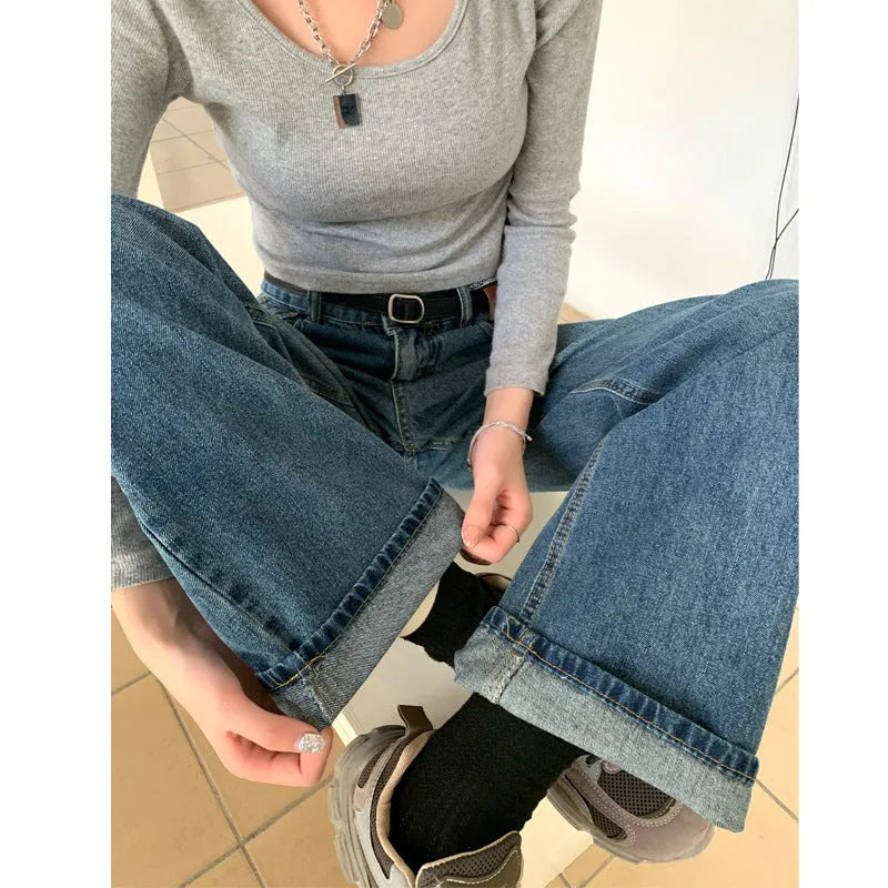 Women's retro blue high-waisted straight leg denim jeans on a neutral background.