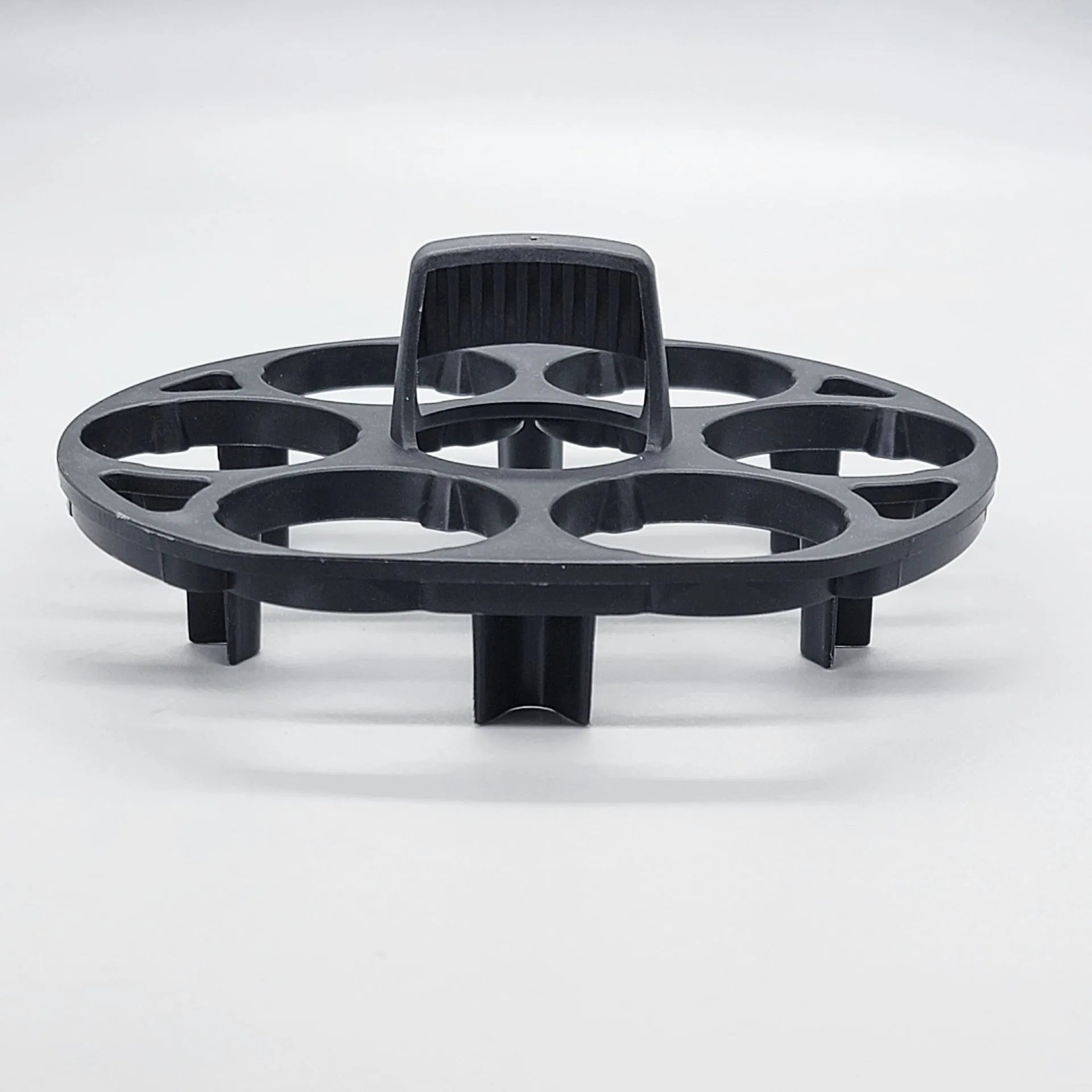 Black plastic egg holder basket for cooking machines measuring 13.8 x 12.6 x 5.7 cm