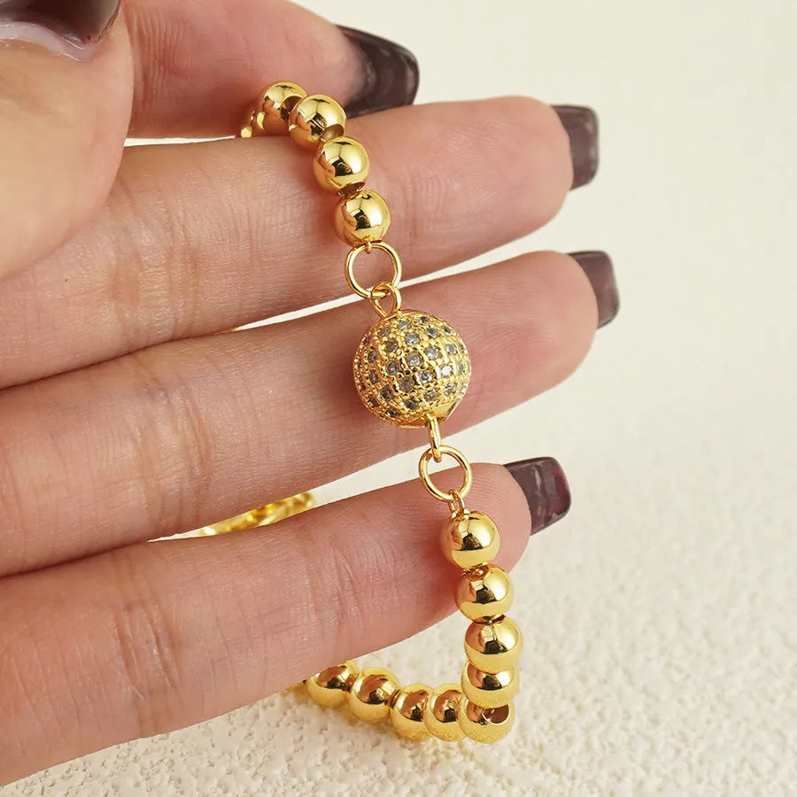 Women's copper bracelet with heart shape design, single ball zircon, and Arabic style elements