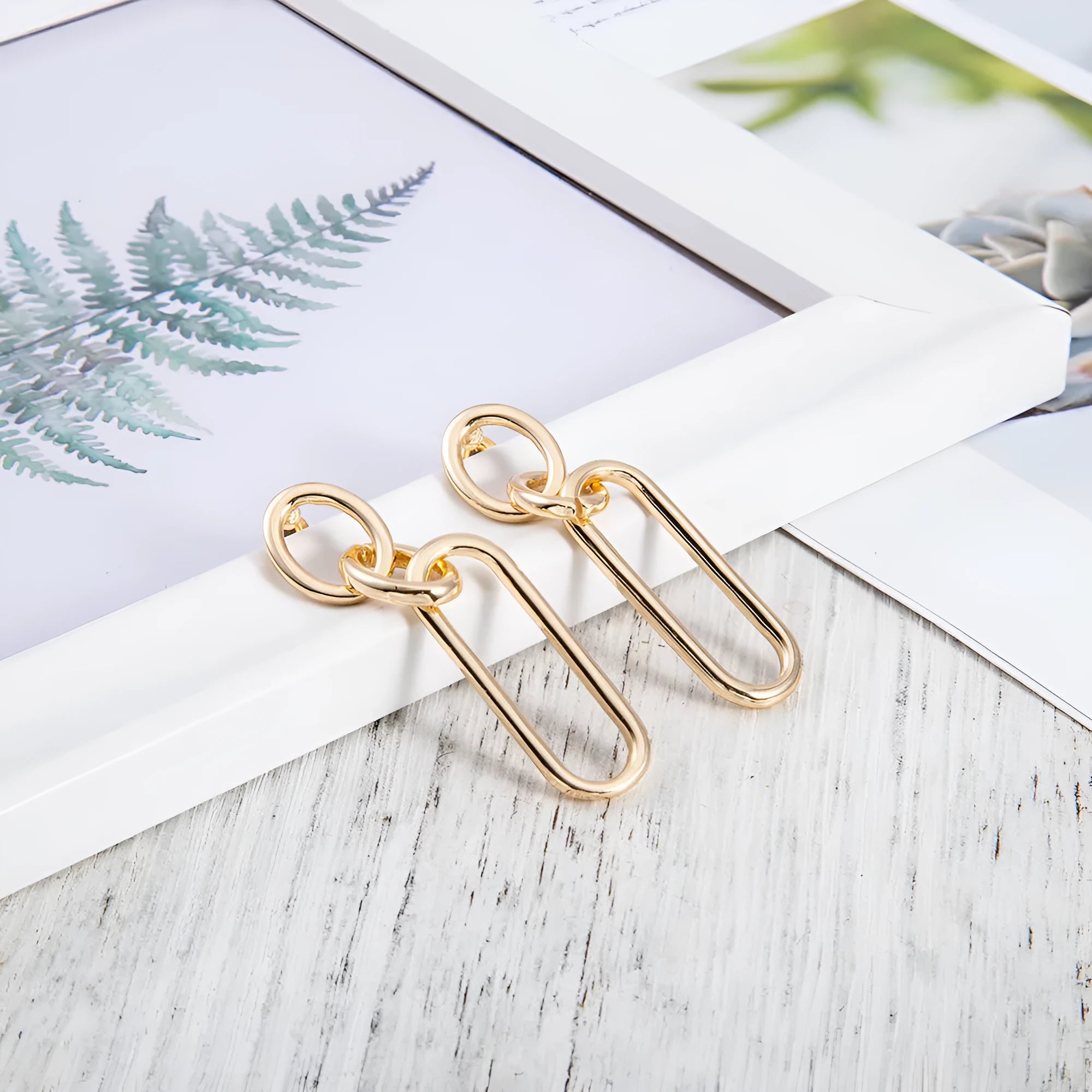 Geometric sterling silver needle colour hoop earrings with ring and line design elements