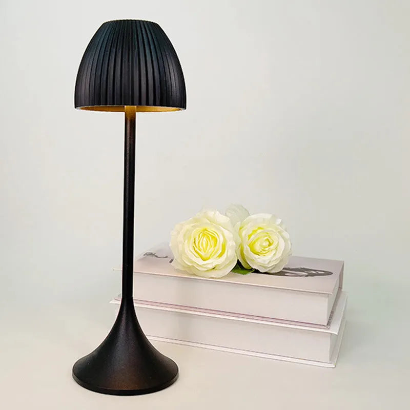 Ins pattern dimmable night lamp with thin round base in black or white, placed on a bedside table.