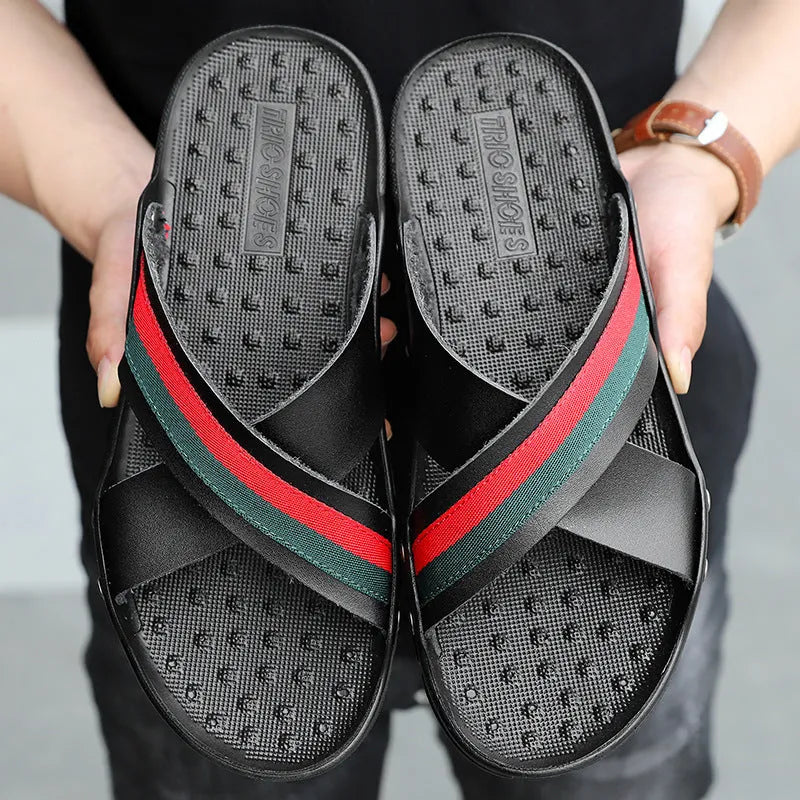 Men's white cowhide leather flip-flops with a non-slip PU sole, shown on a beach background