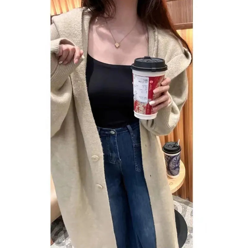 Korean style women's hooded knitted cardigan in wool blend fabric showing below-knee length and loose fit