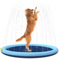 Large blue anti-slip dog splash pad filled with water in a garden, with a dog playing on it.
