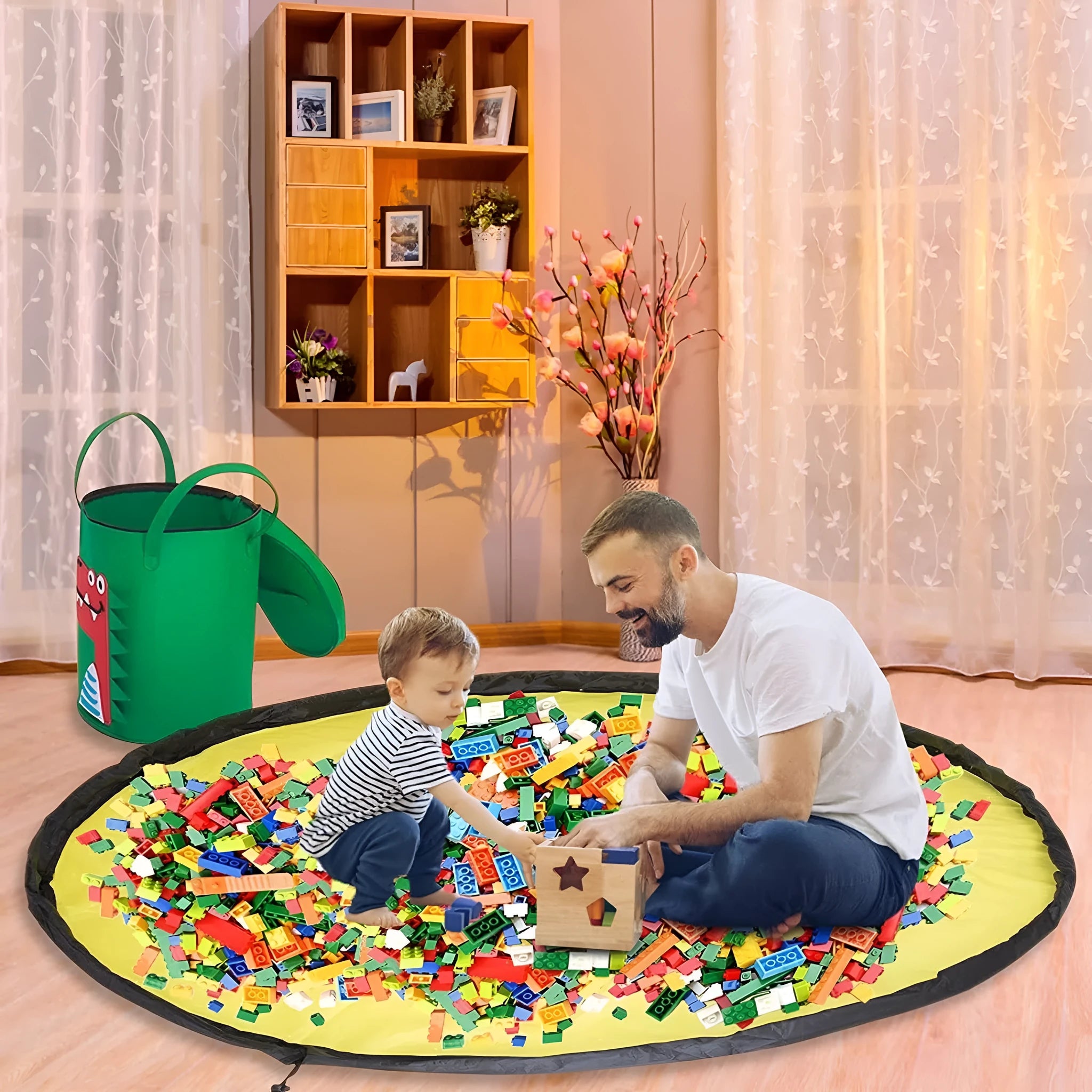 Green felt cube storage bag with a pull rope, shown unfolded as a flat play mat for toys.