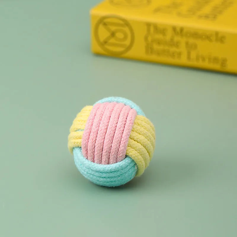 Small handmade cotton plush ball cat toy in blue powder, green blue, or pink green colours, 5cm diameter.