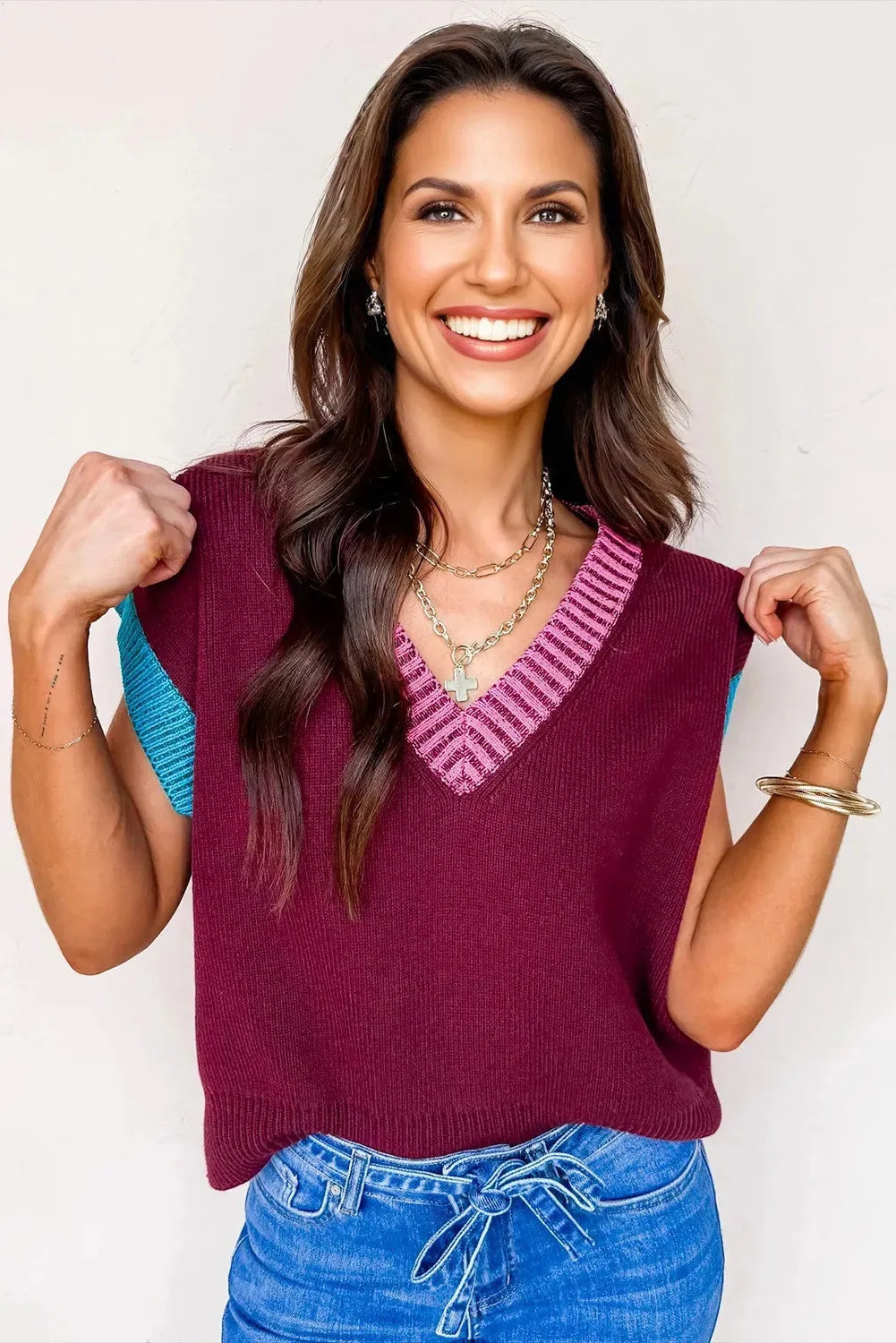 Burgundy women's loose sweater with contrast trim, V-neck, and cuffed short sleeves