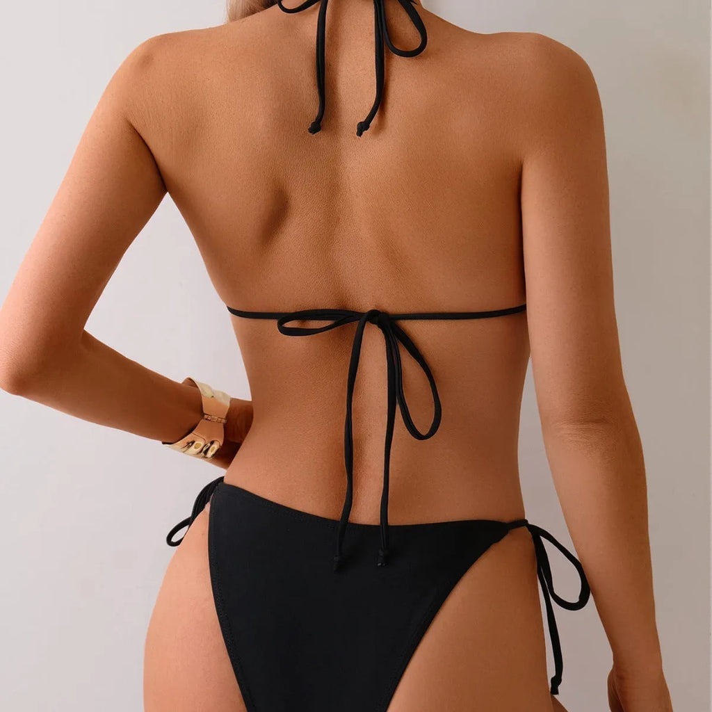 Black women's bikini swimsuit with metal bead decoration on the top.