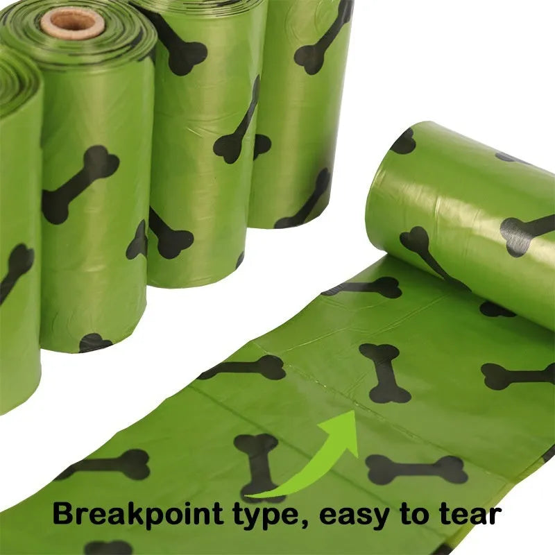 Military green degradable dog poop bags with black bone print pattern, showing roll configuration