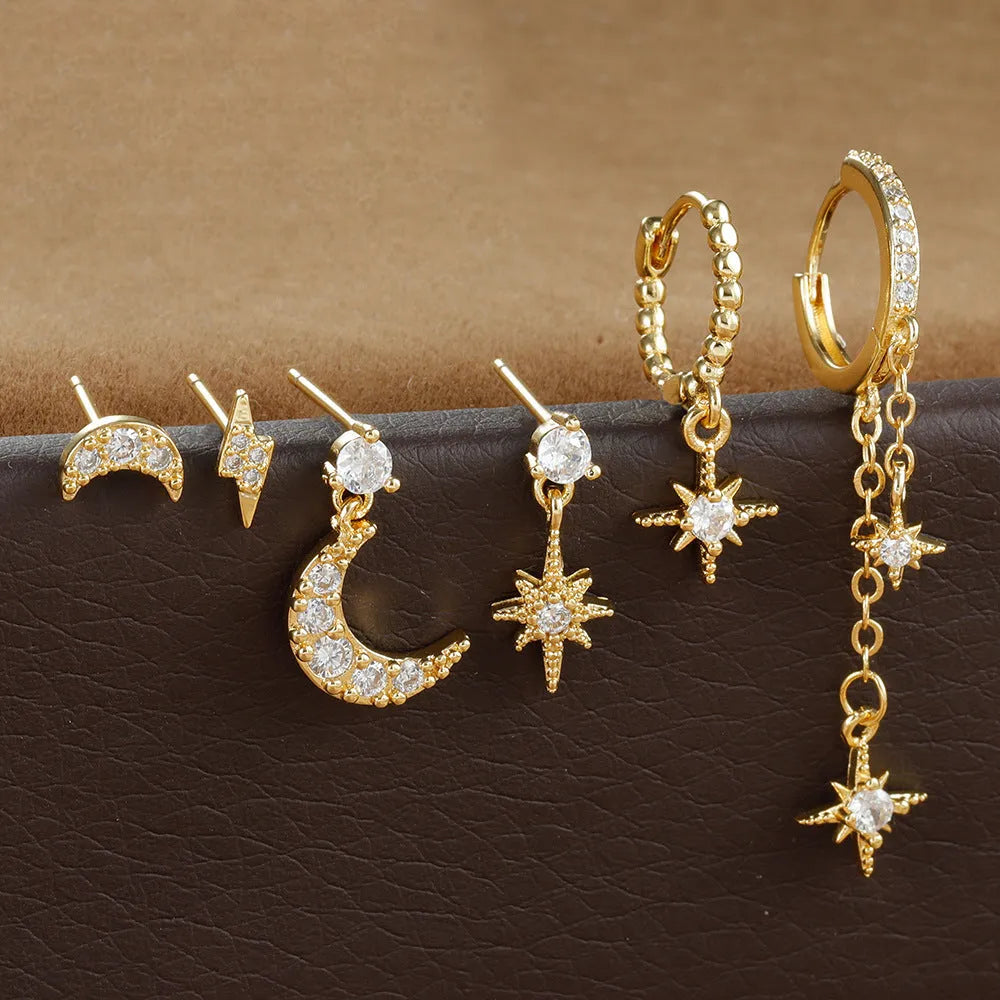 Six pairs of gold electroplated earrings including chain tassel designs and zircon studs for women
