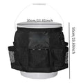 Black cylindrical polyester buggy bag hanging from a 5 gallon barrel for tool storage.