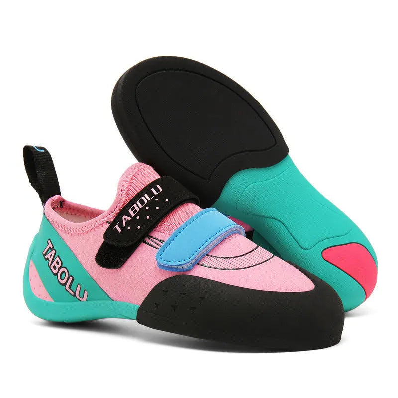 A pair of Velcro closure rock climbing shoes with a non-slip rubber sole in a black and red colour scheme.