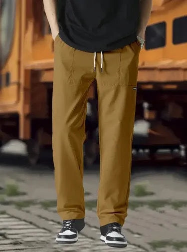 Men's polyester trousers for spring and autumn in various colours including light grey and dark green.