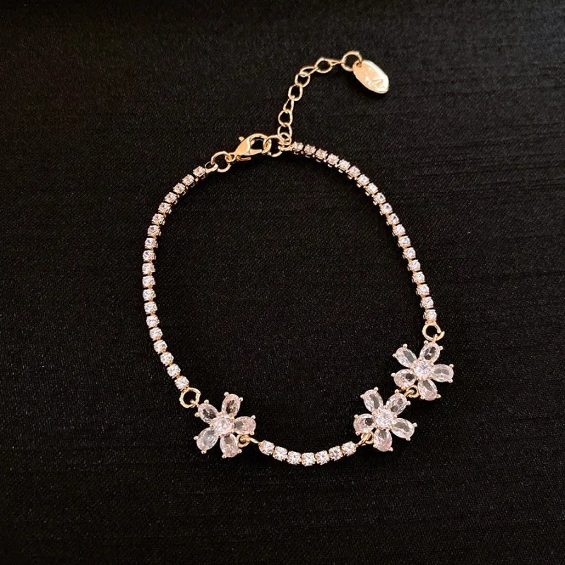Gold tone quadrilateral geometry women's bracelet with inlaid zircon elements on copper