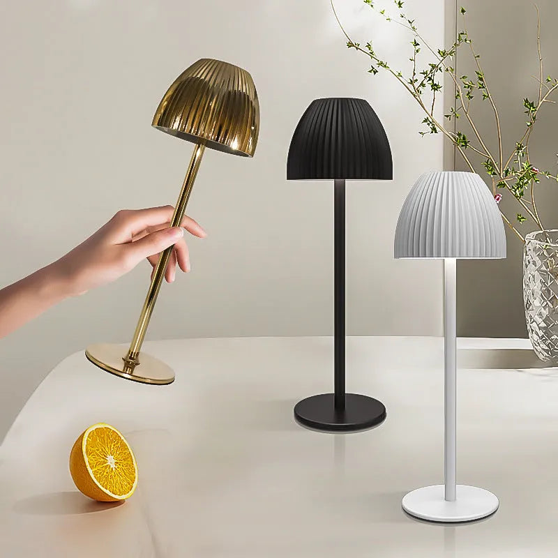 Ins pattern dimmable night lamp with thin round base in black or white, placed on a bedside table.