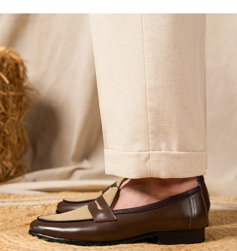 Coffee grey suede slip-on loafers with a rubber sole shown from the side.