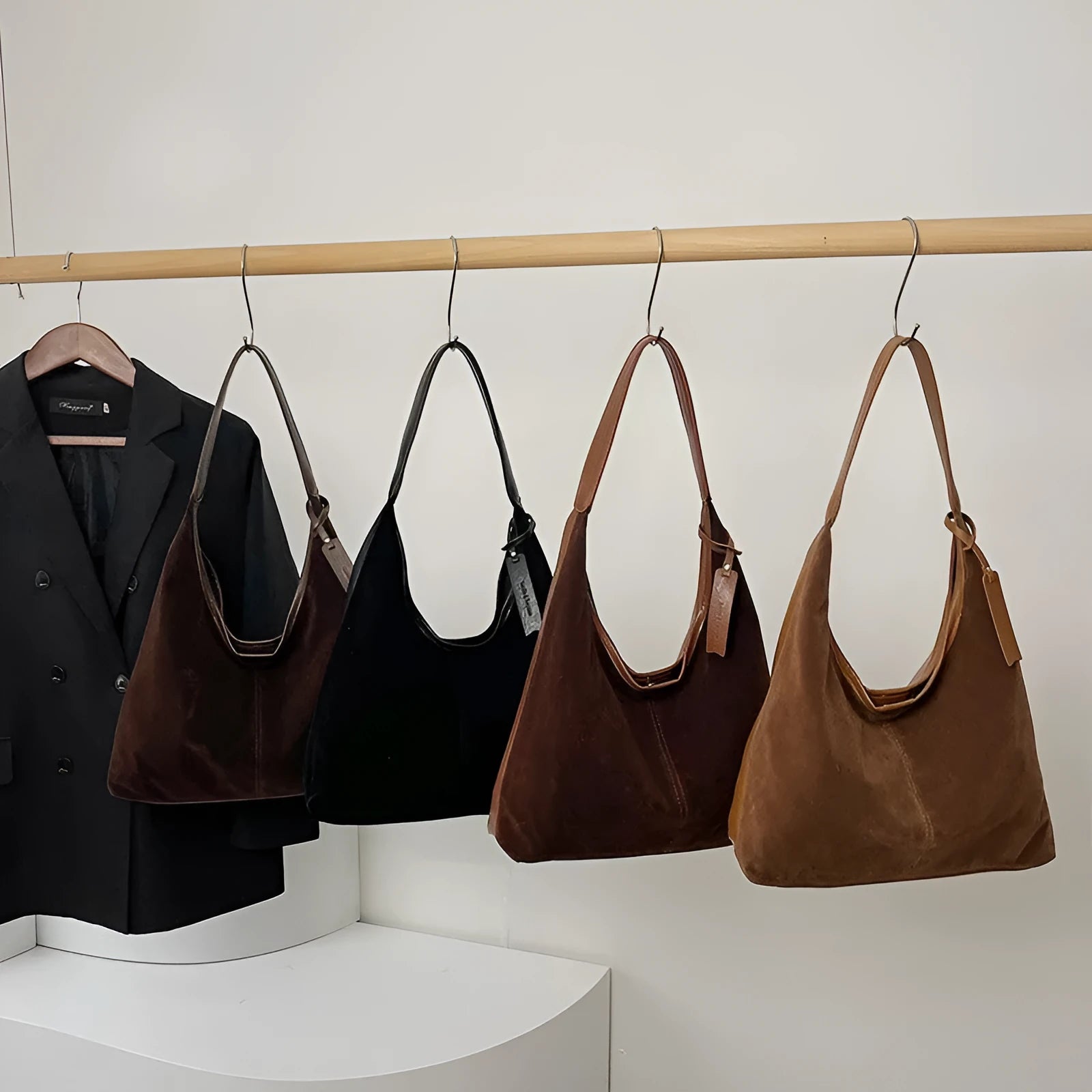 Retro PU shoulder bag with suede stitching and bucket shape in brown colour