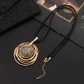 Large round gold geometric pendant on a long adjustable snakeskin rope chain necklace for sweaters