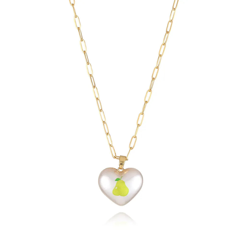 Adjustable chain necklace with a choice of geometric fruit pendant charms: apple, cherry, pear, pineapple, or strawberry.