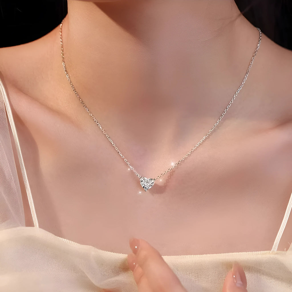 Women's silver necklace with heart-shaped pendant on simple chain