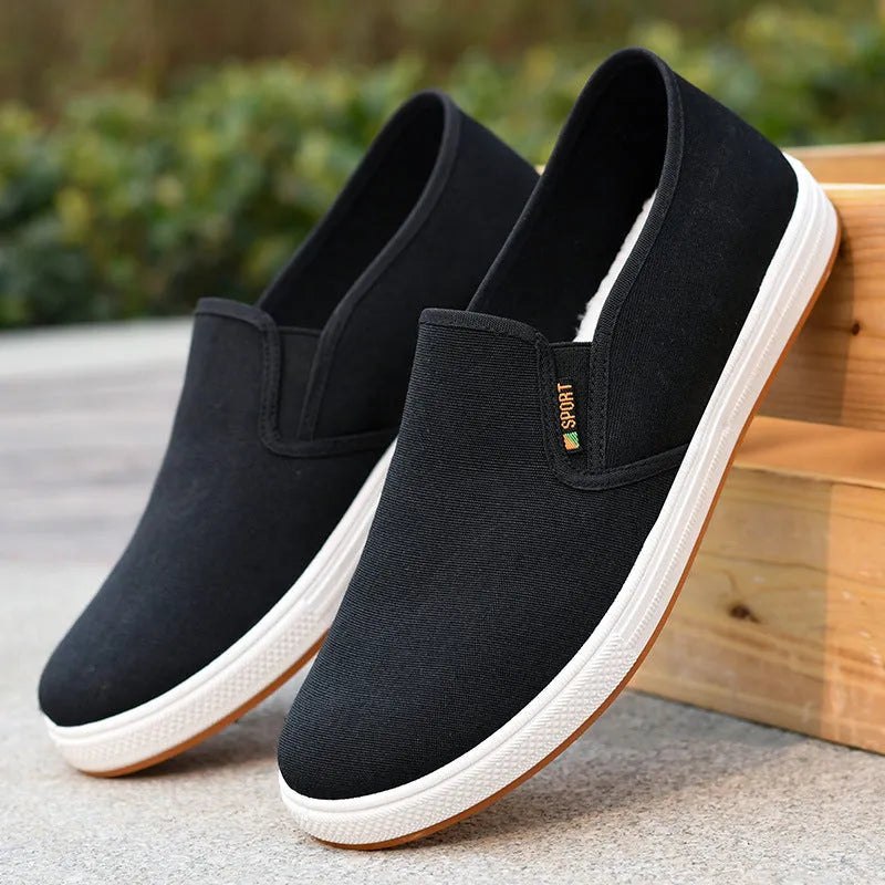 Men's black and blue canvas slip-on shoes with round toe and composite soles