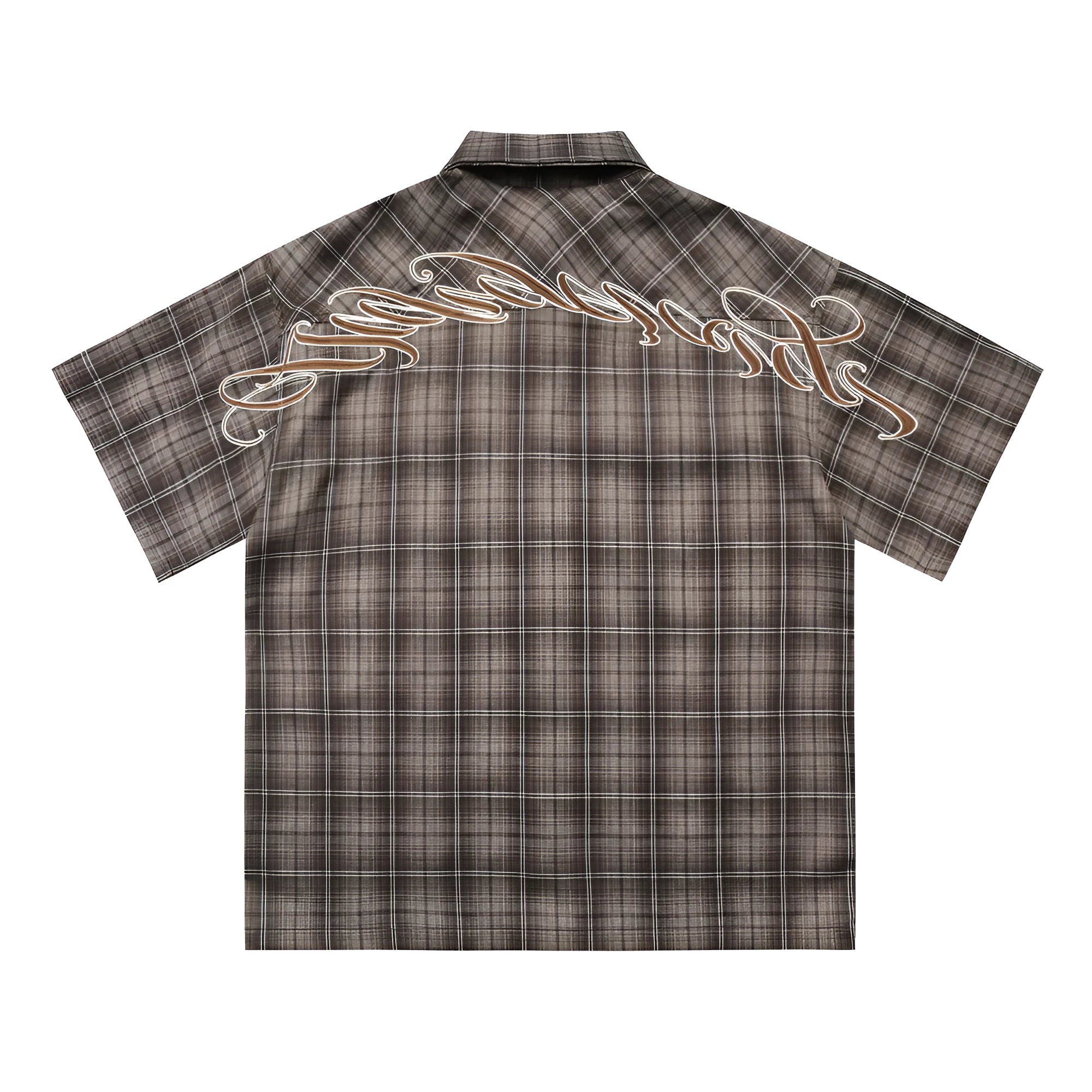 Man wearing a black loose-fit plaid short sleeve shirt with embroidered lettering on the chest.