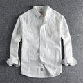 Men's solid colour cotton long sleeve shirt in British retro cardigan style, shown in light blue.