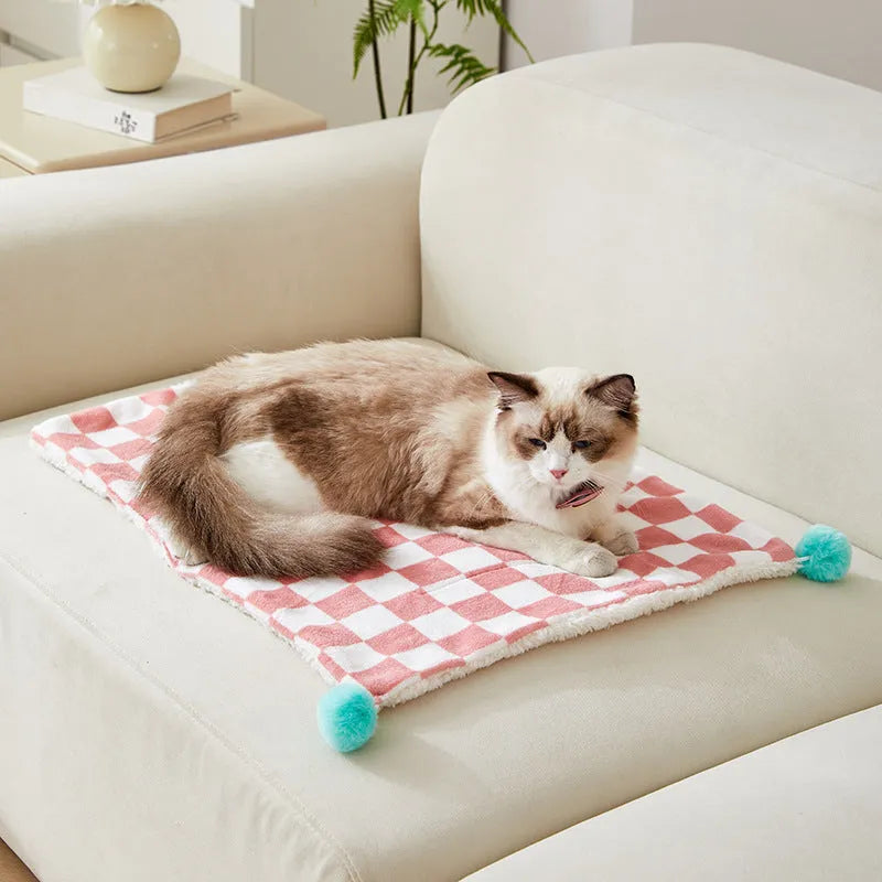 Green plaid pattern pet blanket with decorative fur balls for cats and dogs