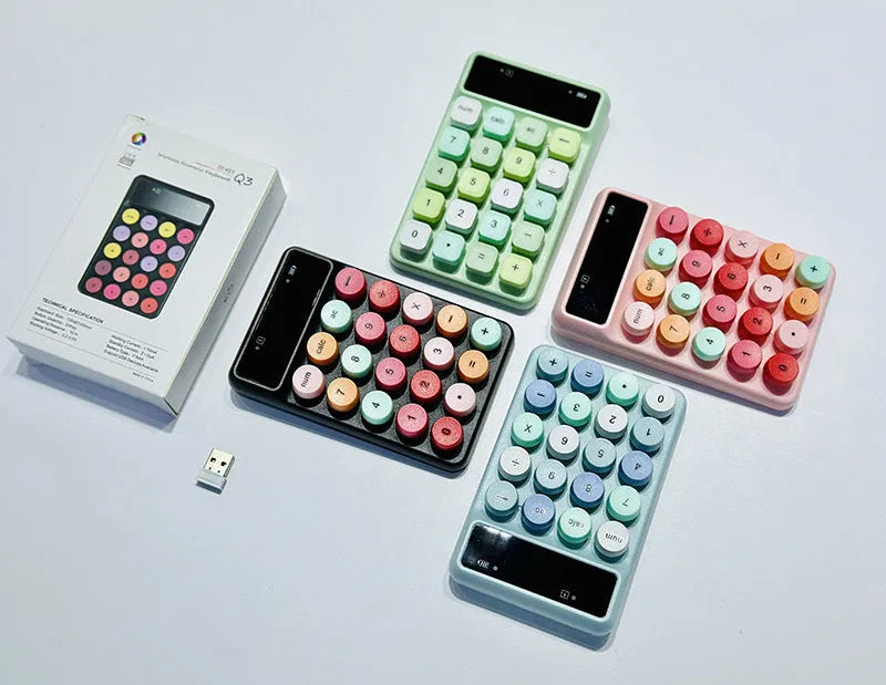 Q3 wireless digital keyboard in a macaron colour option on a desk.