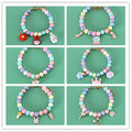 Colourful macaron-style resin pet headdress collar with adjustable sizing for cats and dogs, includes matching bracelet.