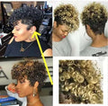 Woman wearing a short synthetic wig with rolled curls in Kanekalon fibre, shown in brown colour.