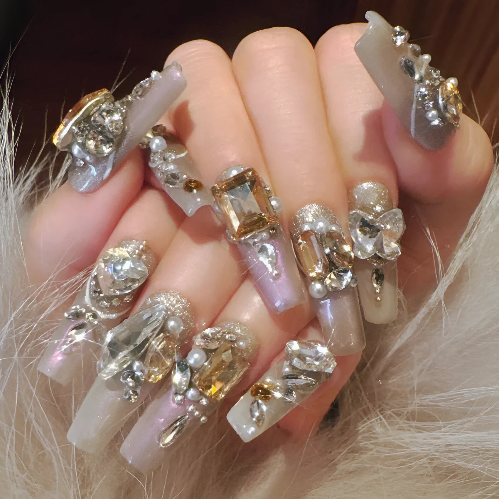 Rhinestone decorated false nail patches on a card, with jelly adhesive or tool set options.