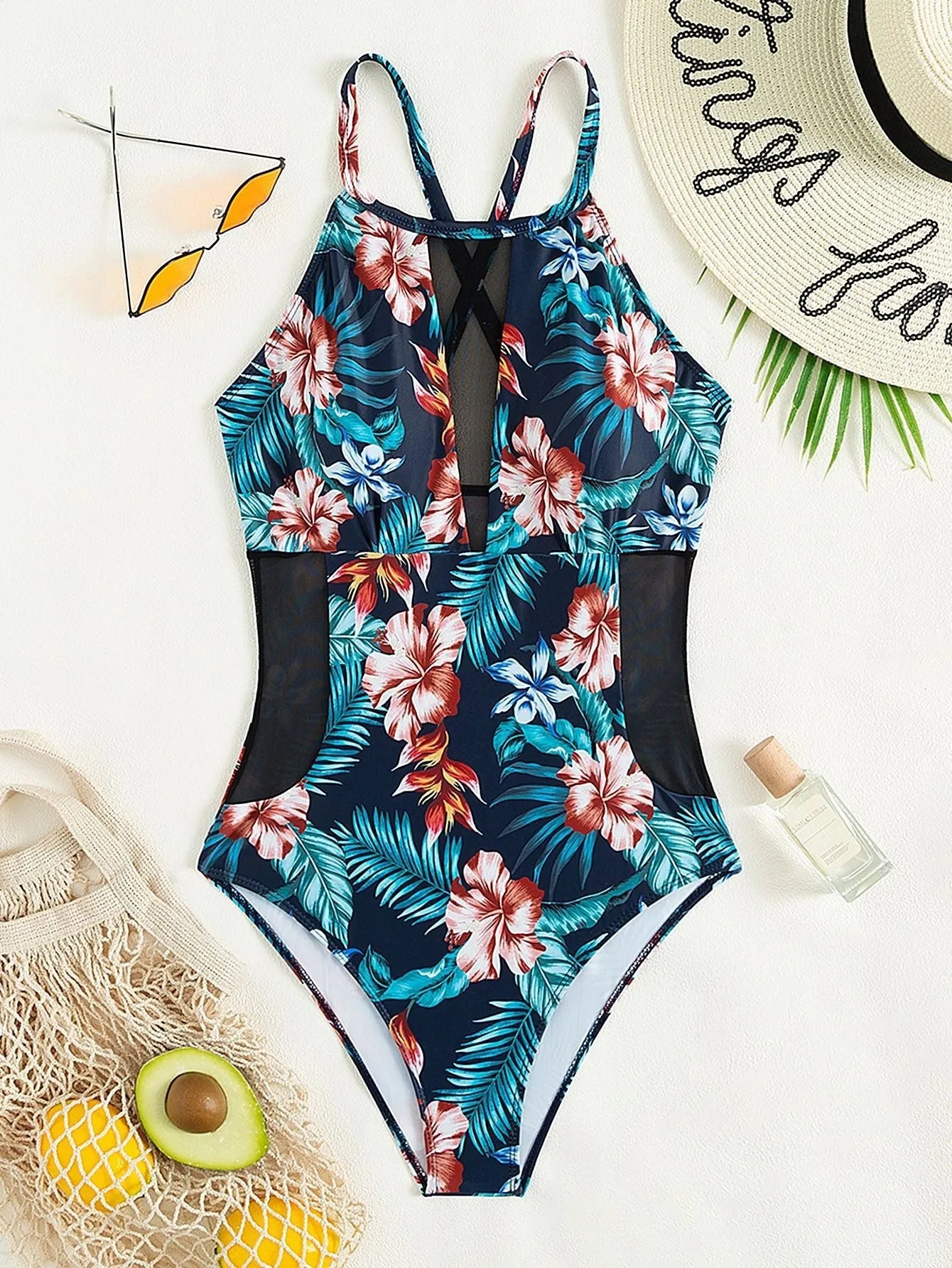 Women's deep V-neck one-piece swimsuit in a printed pattern, shown in a solid colour option.