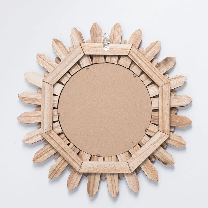 European rustic solid wood circular hanging mirror in baked colour on a wall.