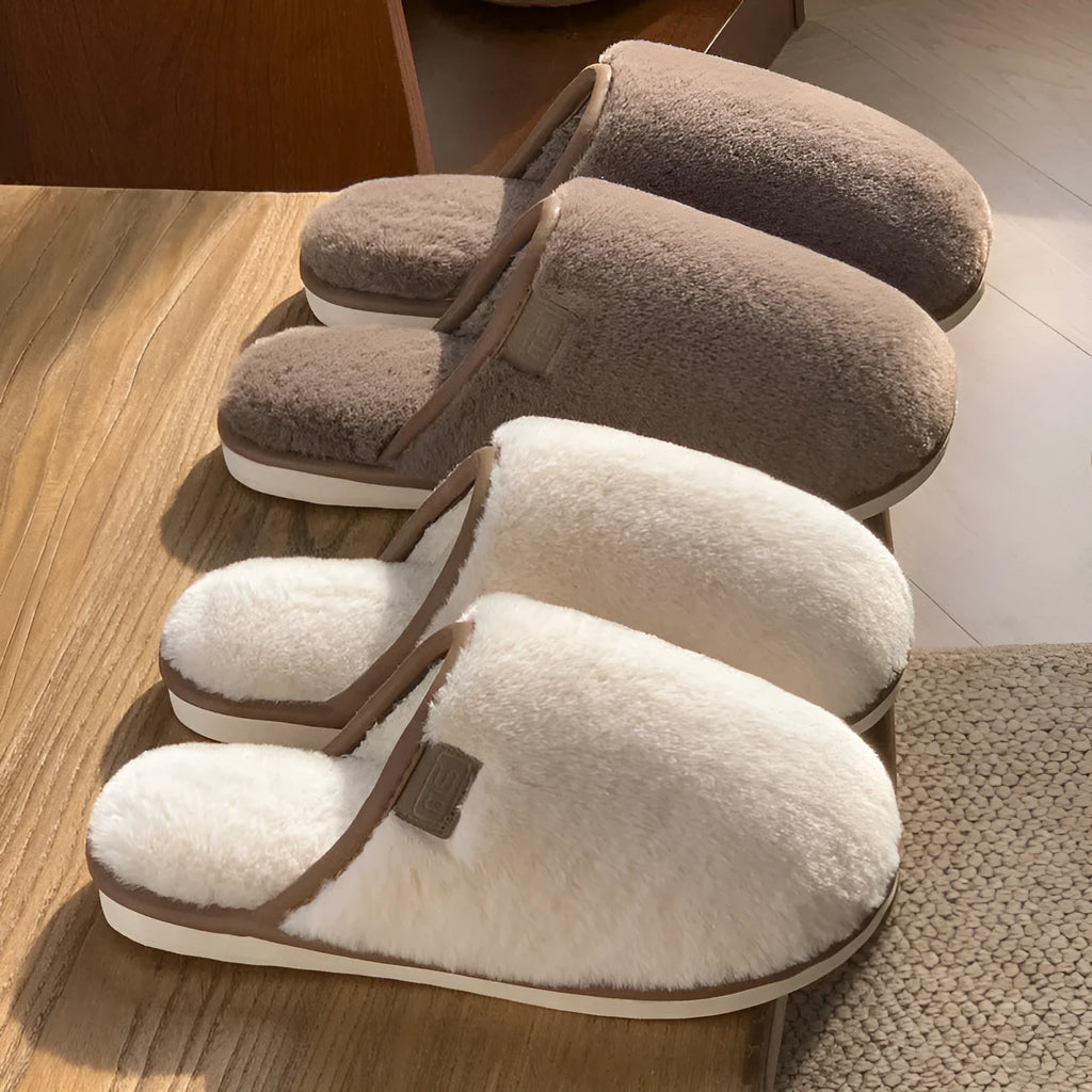 Winter plush slippers in blue colour with non-slip PVC soles, showing car stitching detail
