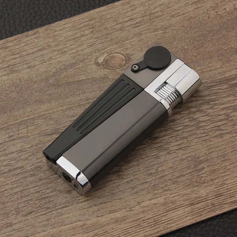 Metal pipe lighter with folding flap covering lighter mechanism and stash compartment