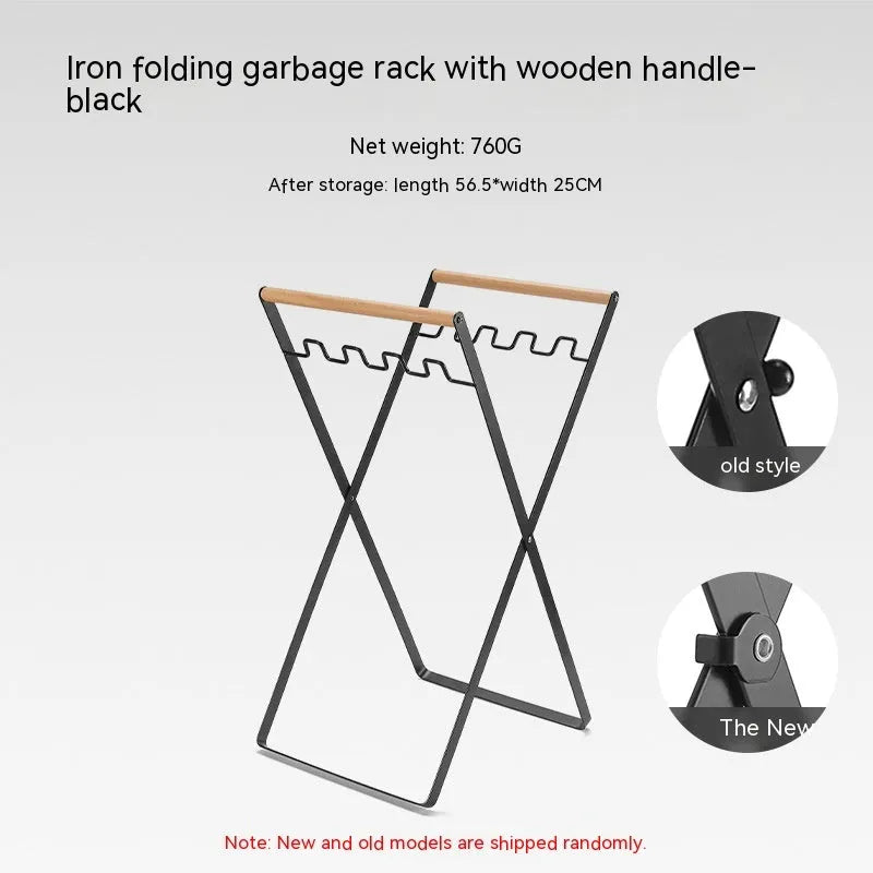 Black folding iron trash storage rack with a wooden handle holding a bin bag.