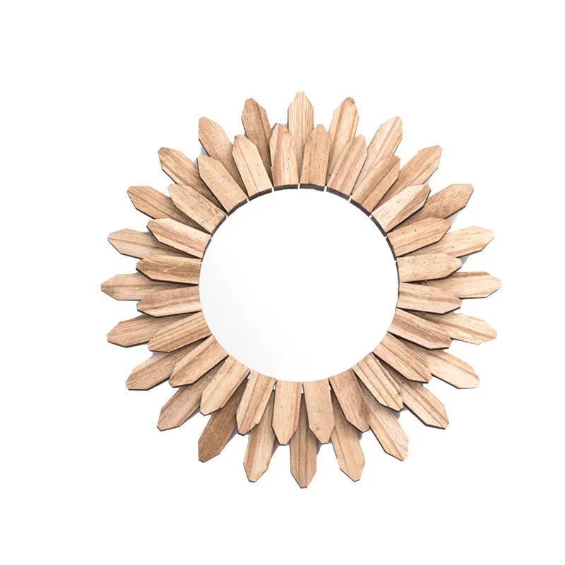 European rustic solid wood circular hanging mirror in baked colour on a wall.