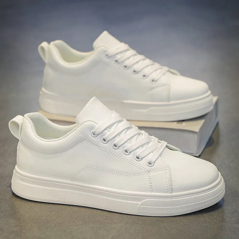 Men's low-top Korean-style sneakers in white, black, and black with white sole colours on a plain background.