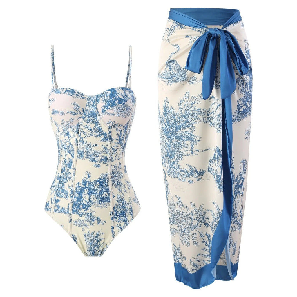 Women's blue one-piece swimsuit set with matching gauze skirt on a size chart