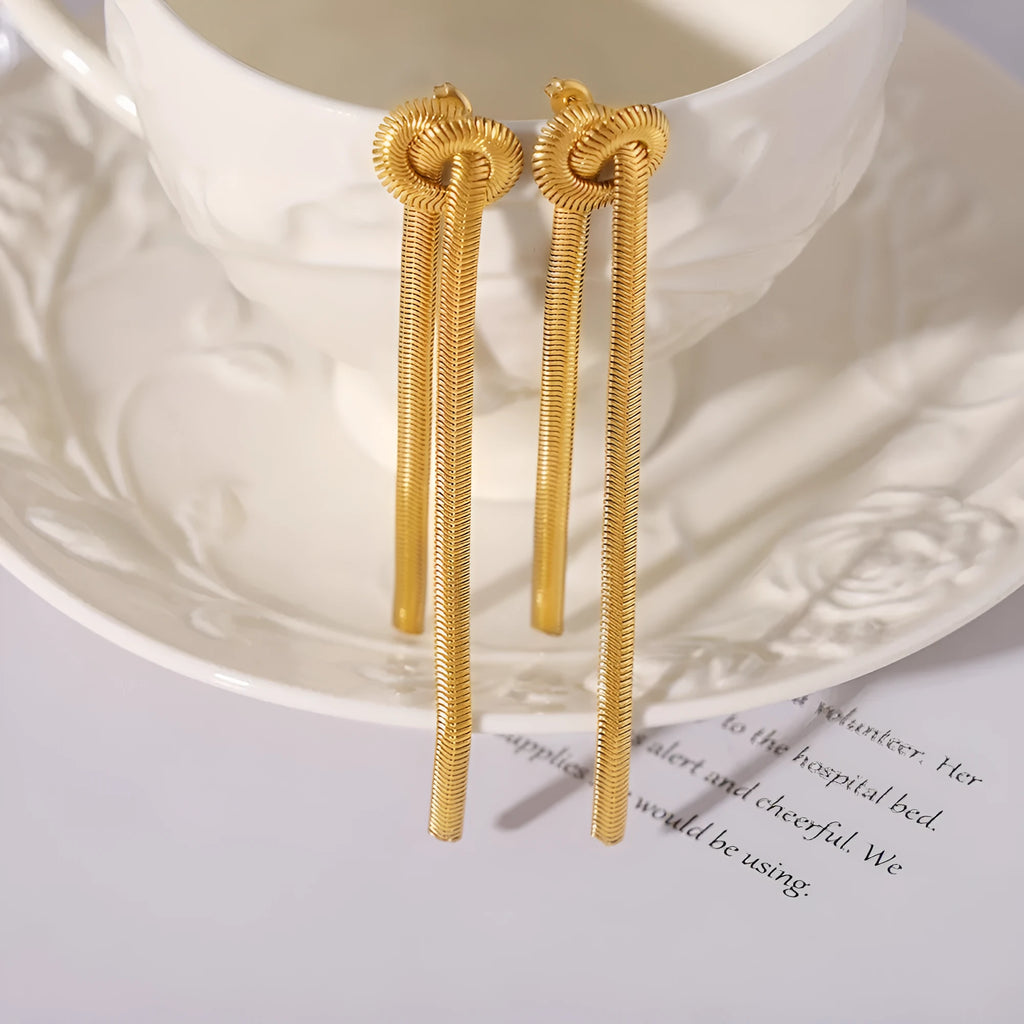 Gold knotted tassel pendant on titanium steel snake chain necklace with matching electroplated earrings