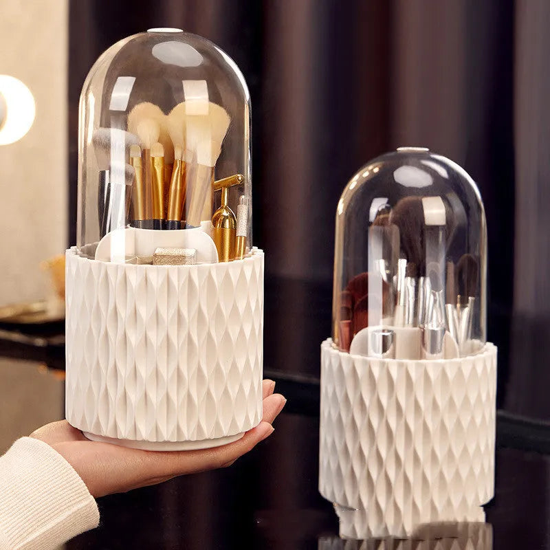 White rotating transparent makeup brush storage box with lid on desktop