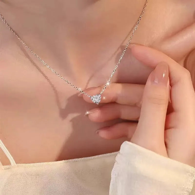 Women's silver necklace with heart-shaped pendant on simple chain