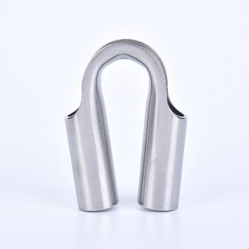 Stainless steel tubular chicken heart ring round sleeve ring set on a workshop surface