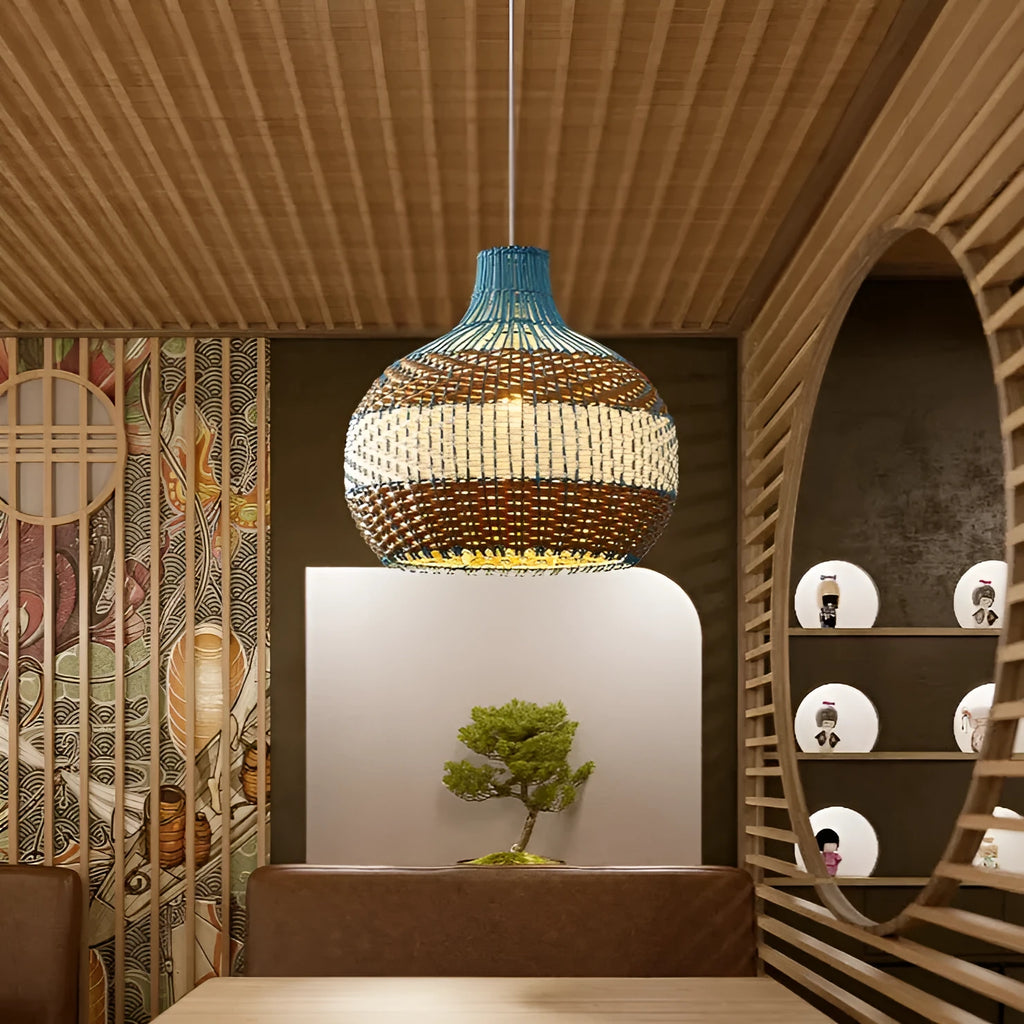 Natural woven vine pendant lamp with a pastoral design in a Southeast Asian style, hanging from a ceiling.