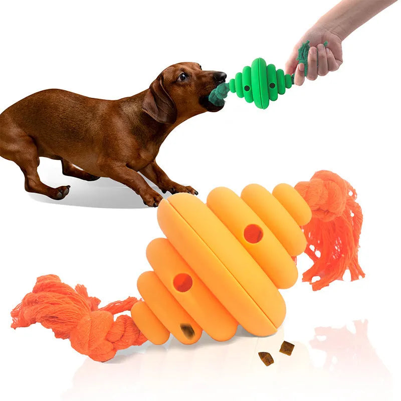 Green and yellow silicone dog ball with integrated rope, shown as a food-dispensing chew and tug toy.