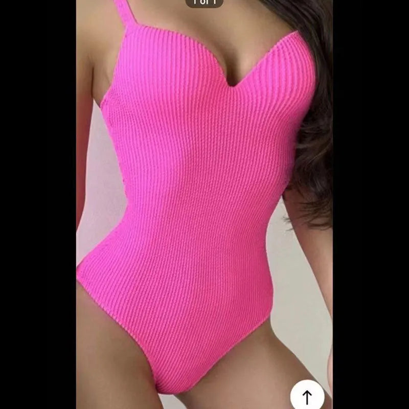 Women's black one-piece swimsuit with sunken stripe pattern, sleeveless design